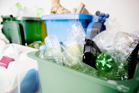 used-plastic-bottles-recycling-bins-earth-day-campaign
